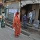 Women queue on areas circles marked on the ground to maintain social distancing while waiting for rations at a government ration store during a government-imposed nationwide lockdown as a preventive measure against the COVID-19 coronavirus, in Siliguri on April 1, 2020.